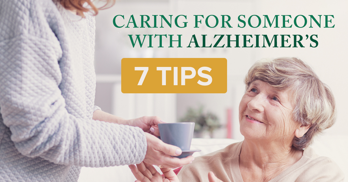 Caring for Someone with Alzheimer's - 7 Tips. Women handing older women cup of tea.